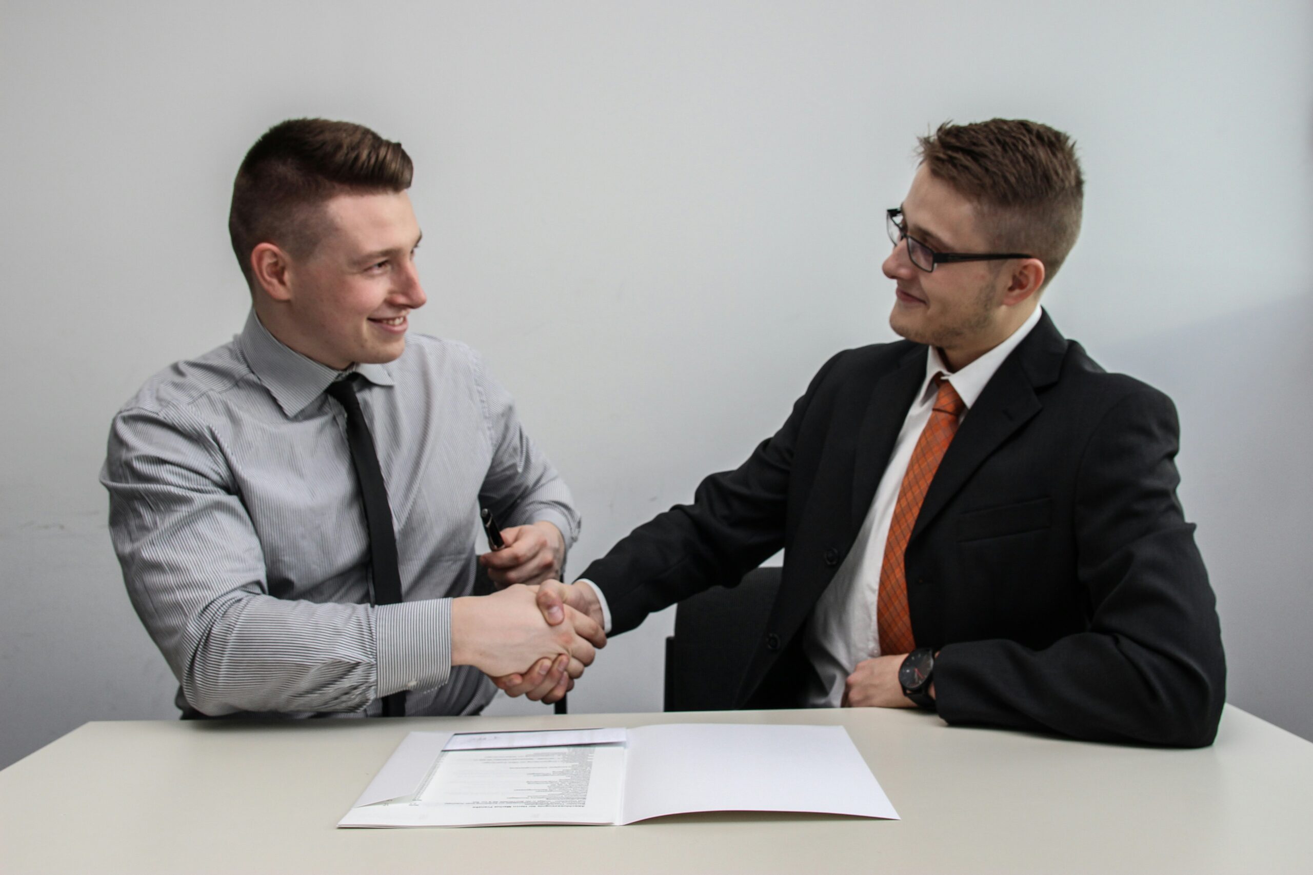 two men doing a handshake